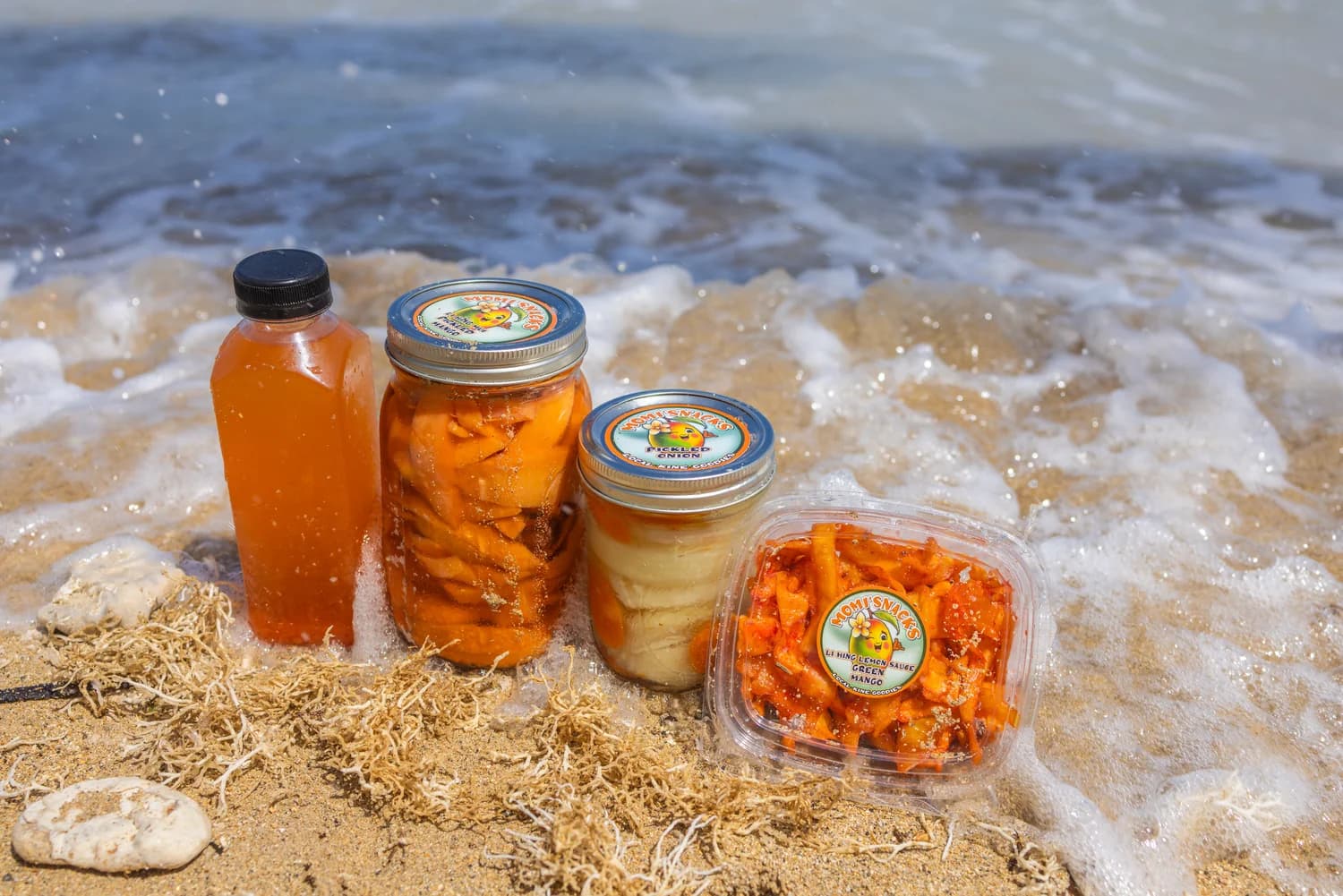 Momi'snacks jars in the surf on a Hawaiʻi beach